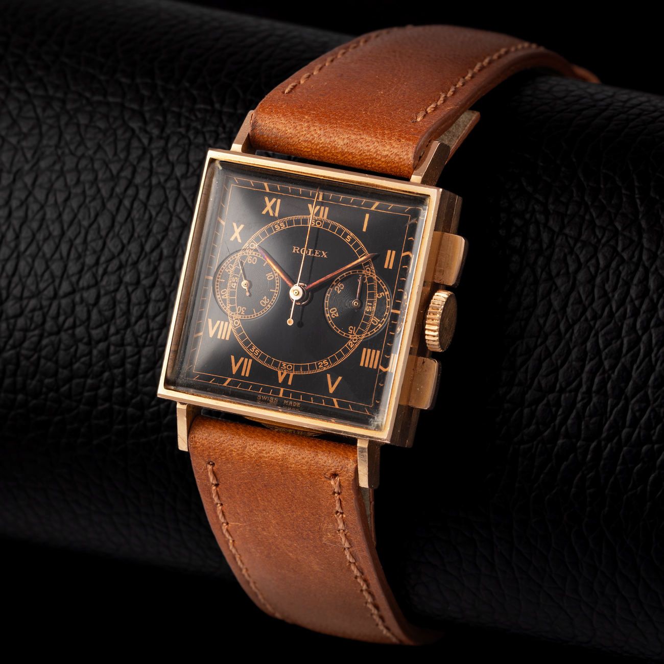 Lot 125 – Exceptional Rolex square-shape chronograph wristwatch in pink gold, reference 3529. With black gilt dial – View Lot