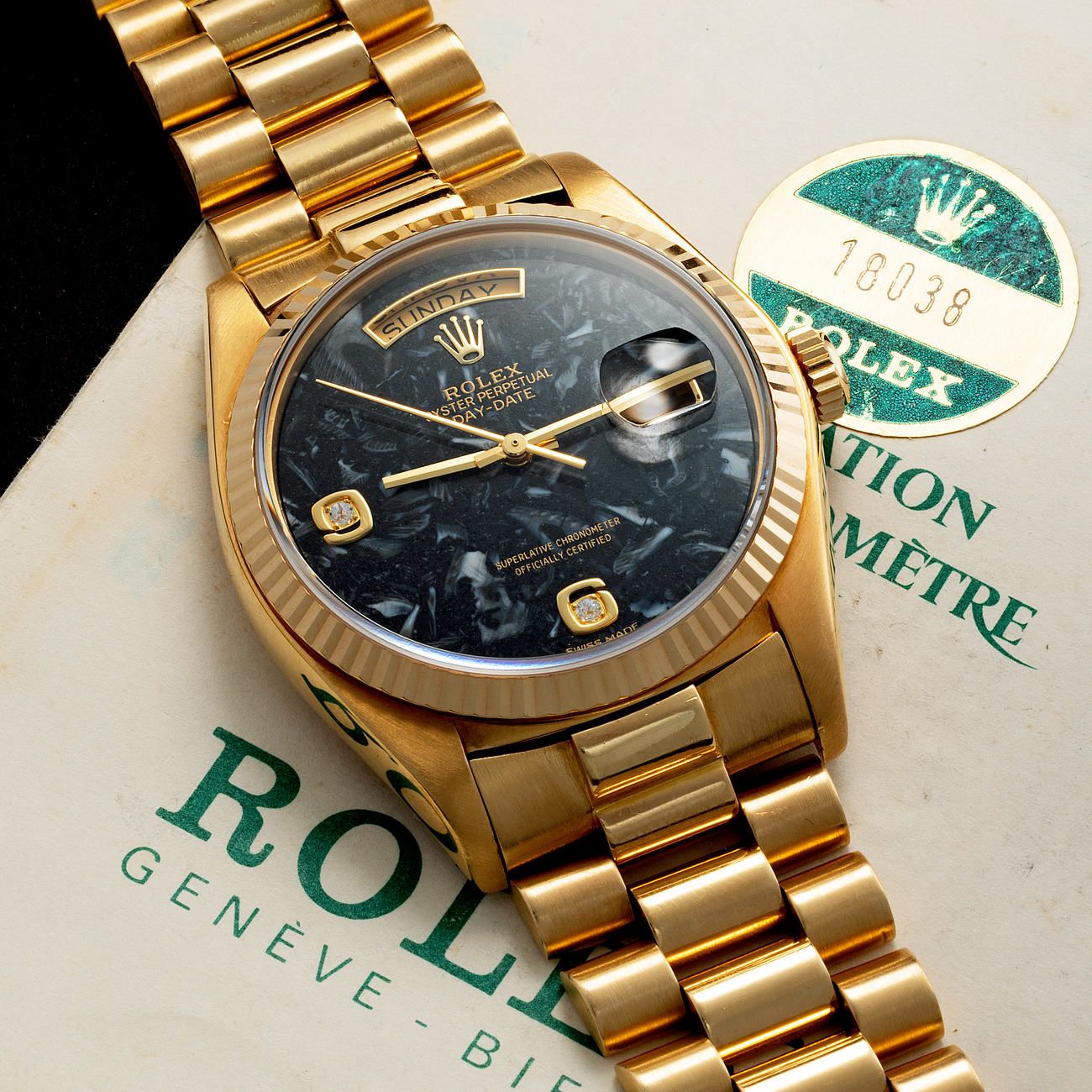 Lot 16 - Charismatic and Colorful, Day-Date, Automatic Wristwatch, in Yellow Gold, Fossilized Limestone Dial, Reference 18 038, With Warranty – Estimate: € 25,000 – 50,000 – View lot detail