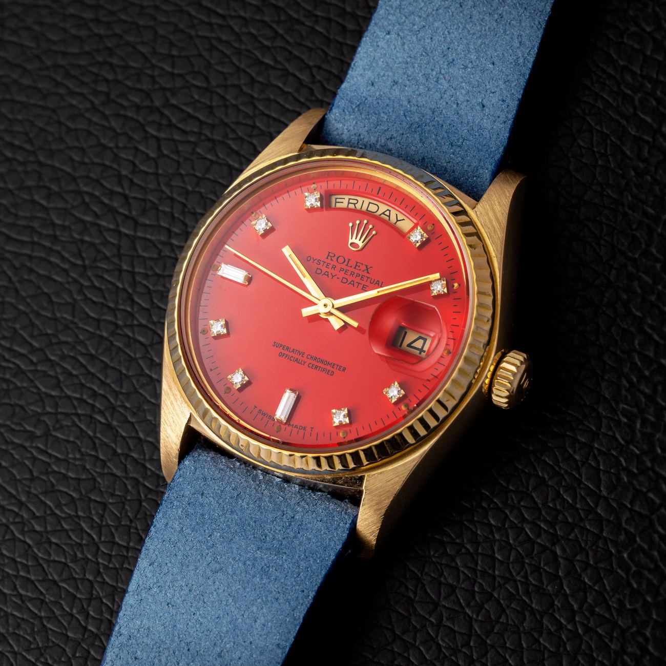 Lot 86 – Rolex Day-Date in yellow-gold reference 18 038, with red lacquered “Stella” diamond dial. 