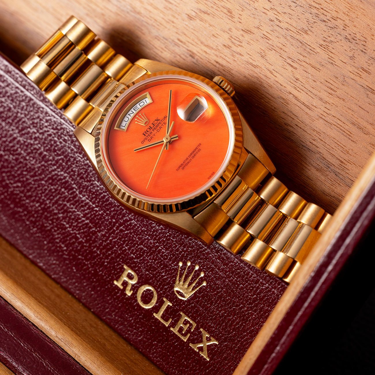 Lot 6 – Rolex Day-Date in yellow-gold reference 18 238 with Coral dial. Box and papers.