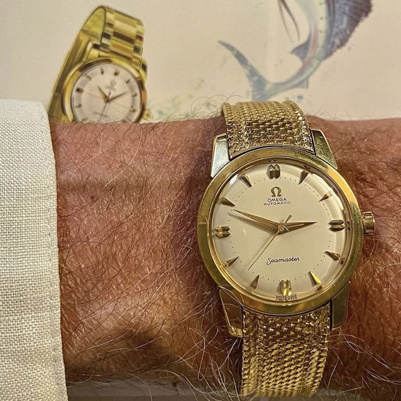 Lot 5 on Goldberger's wrist - An exceptional Seamaster in yellow gold with white dial and original yellow gold bracelet.
