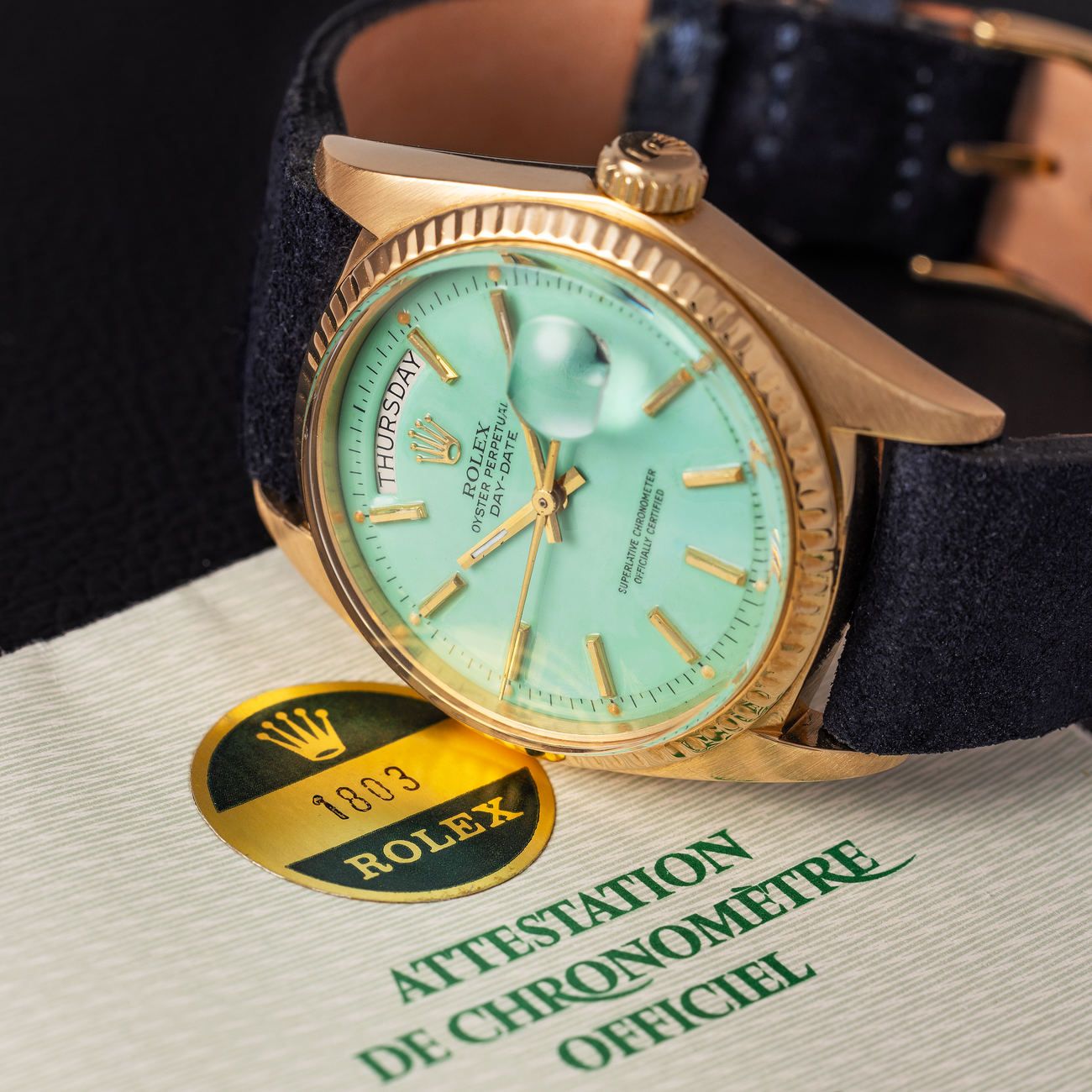 Lot 238 – Reference 1803 Day-Date, in yellow gold, with seafoam lacquered “Stella” dial. Complete with warranty and service papers.
