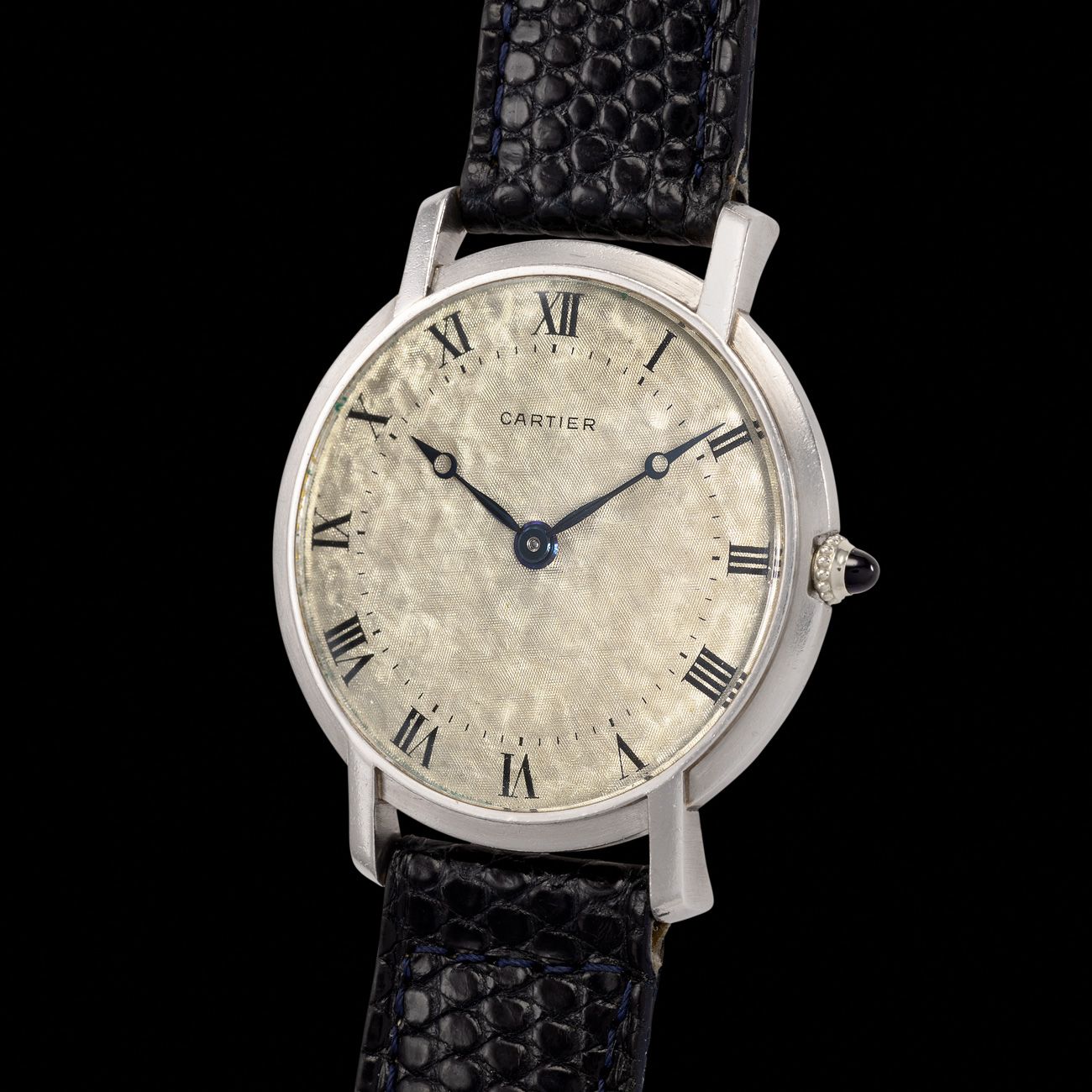 Cartier Ronde, Platinum (1950s)A rare platinum Ronde watch with a unique hammered guilloché dial, featuring an Audemars Piguet movement.