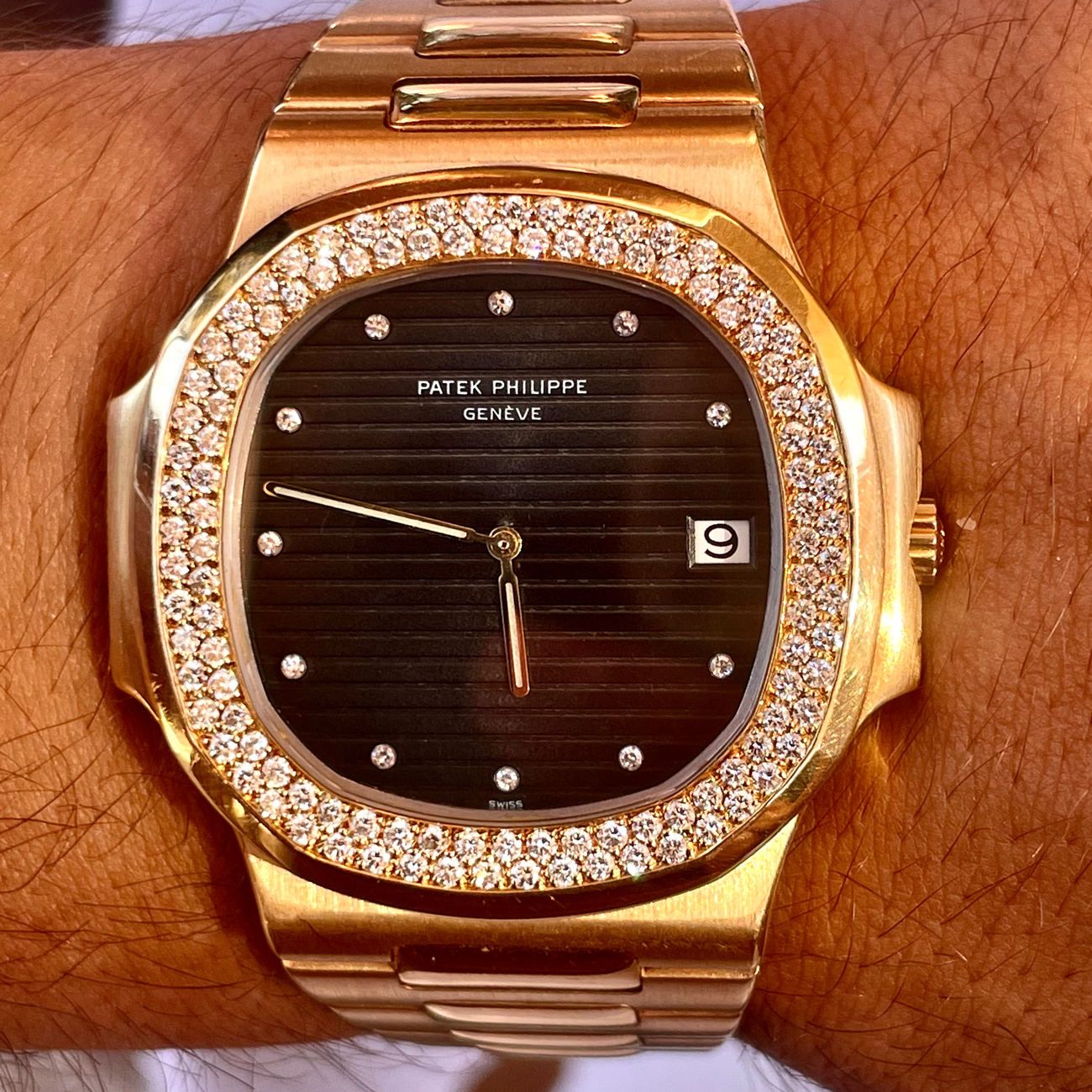 Patek Philippe reference 3700 Nautilus Jumbo in 18k yellow gold with rare diamond bezel and black diamond dial.