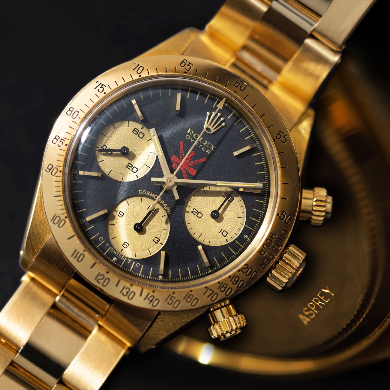Lot 160 — Exceptional and Iconic, Daytona Cosmograph, Wristwatch in Yellow Gold, Black Dial, Red Khanjar Logo, Retailed by Asprey for the Sultanate of Oman, With Asprey Letter, Reference 6265 – Estimate: € 500,000 – 1,000,000 — View lot detail