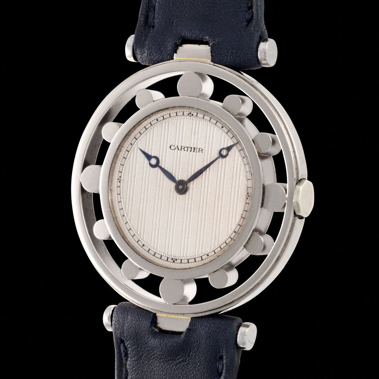 Lot 218 - An extremely rare white gold “Giant” Gouvernail, or Helm watch, published in White Cartier Bianco and featuring a guilloché dial and "roue à 12 points" markers.