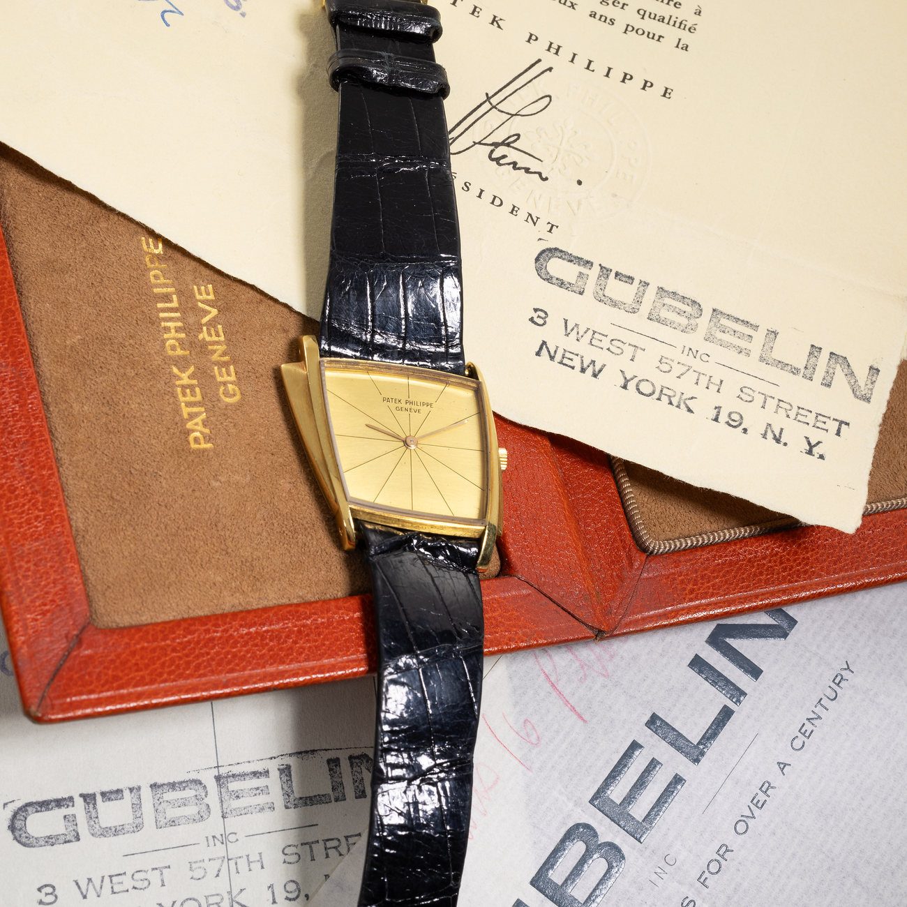 An outstandingly rare 1960's Patek Philippe, reference 3422 “Gilbert Albert” asymmetrical wristwatch in 18K yellow gold, sold by Gubelin and accompanied by its full set of original documentation and box. Truly the most perfectly preserved example of this reference we have ever seen, consigned during the Miami Show, and to be featured in our upcoming Exclusive Timepieces auction.