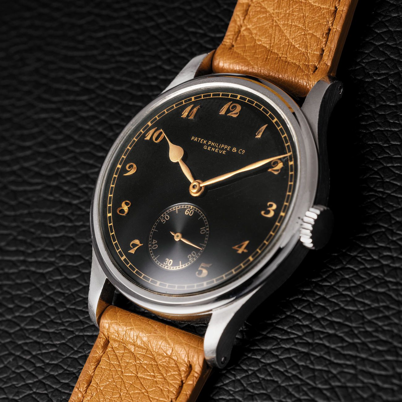 Lot 108 – Calatrava wristwatch reference 530, in 37 mm steel case with a glossy black dial and gold Breguet numerals, an exceptional timepiece from John Goldberger’s personal collection.
