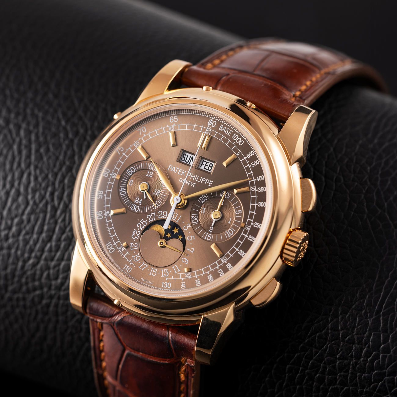 Lot 202 – “Saatchi Edition” 5970, created for the 2015 Patek Philippe Watch Art Grand Exhibition and one of just five pieces ever made, with brown sunburst dial in as new conditions. 
