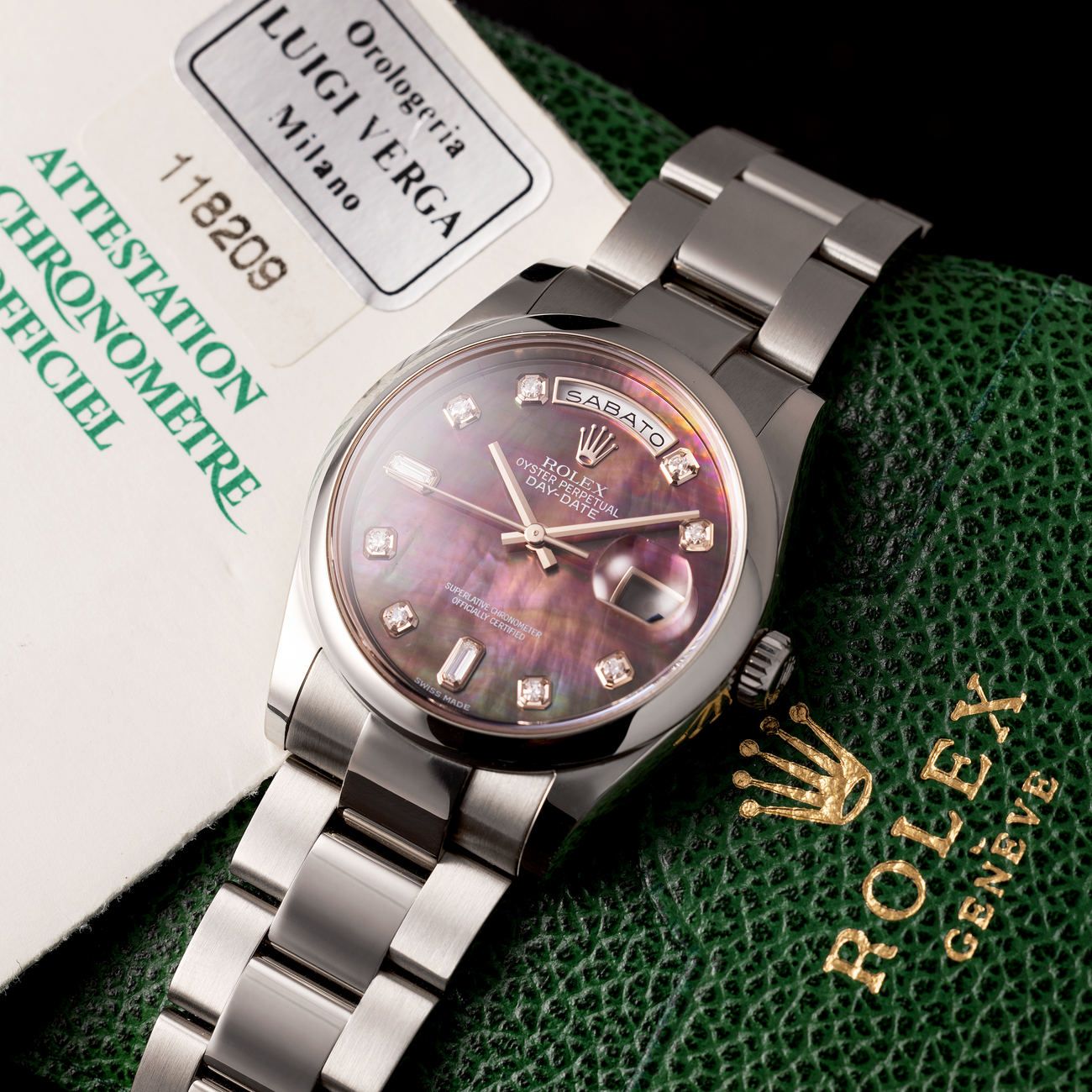 Lot 248 – Reference 118 209 Day-Date in white gold, with mother-of-pearl diamond index dial. Complete with box and papers. 