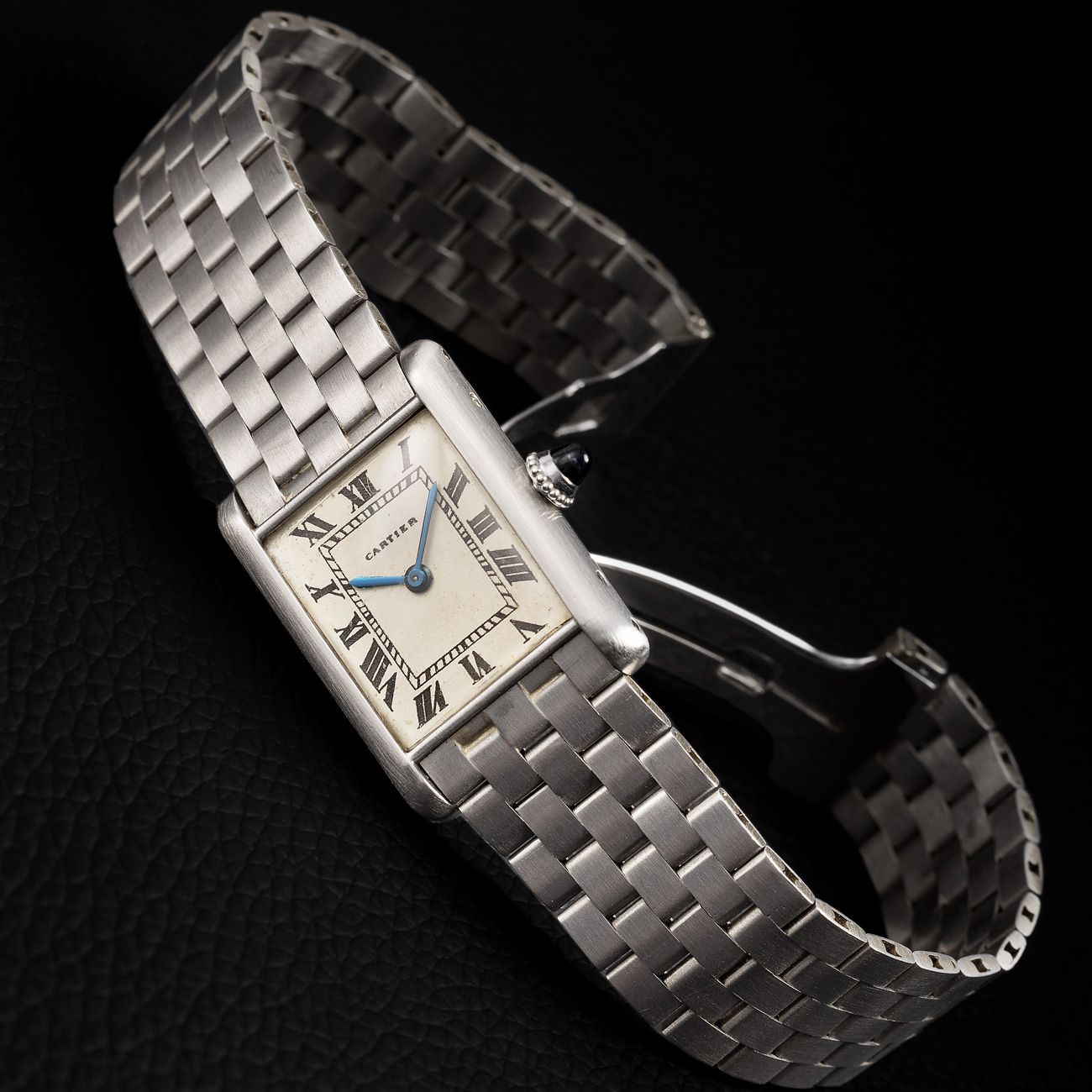 Cartier Tank Normale, Platinum (1960s)An exquisite platinum Tank Normale with a classic black Roman numeral dial and Cartier's signature design innovation.