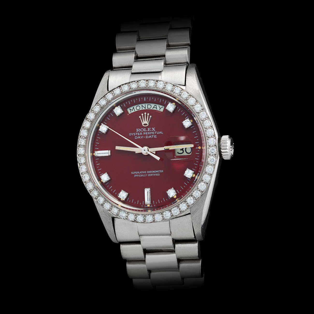 Lot 238 - Striking and Precious, Day-Date, Automatic Wristwatch in Platinum, With Burgundy “Stella” Dial, Diamondset Bezel and Indexes, Reference 1804 – Estimate: € 50,000 – 100,000 – View lot detail