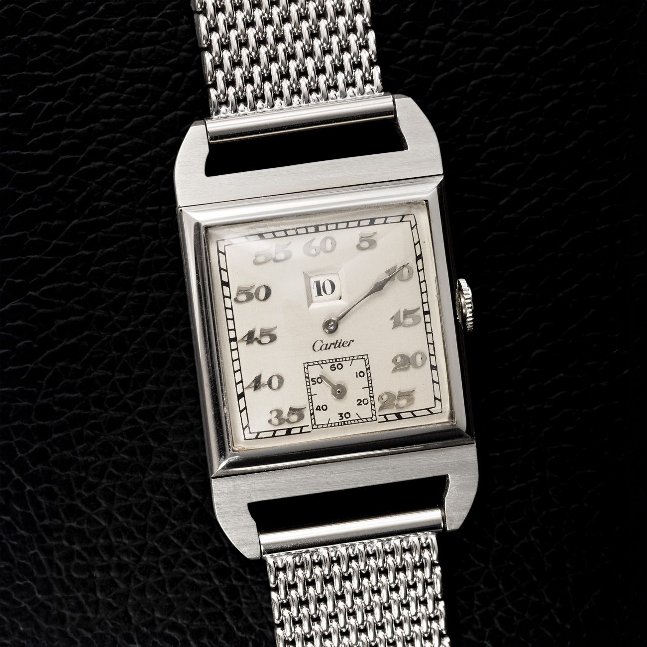 Audemars Piguet Heure Sautante, White Gold (1930s)Retailed by Cartier, this extraordinary jumping hour watch combines Art Deco flair with mechanical artistry.
