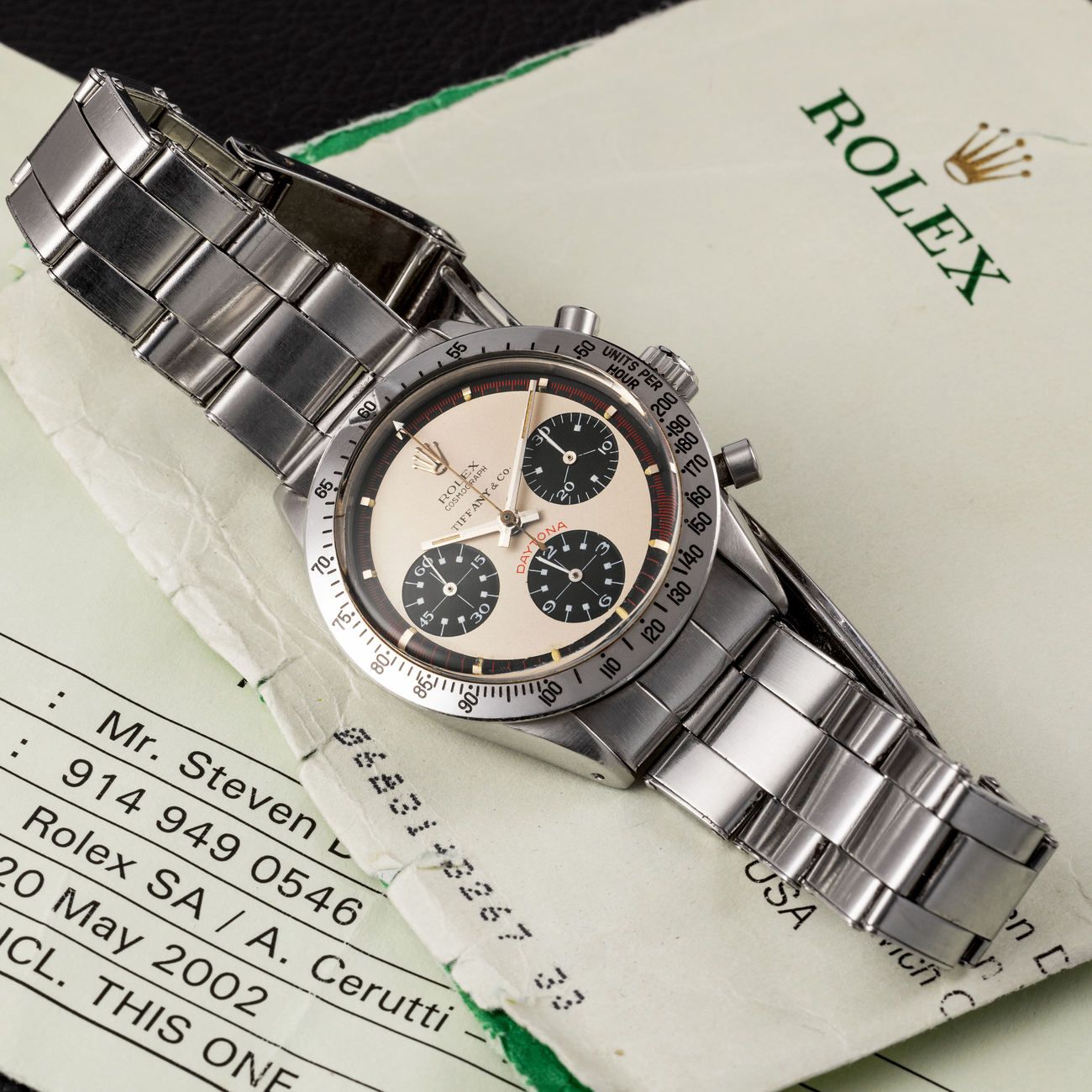 Lot 27 — Daytona chronograph in steel reference 6239, with white Paul Newman dial, retailed by Tiffany & Co with Rolex letter of confirmation – View Lot