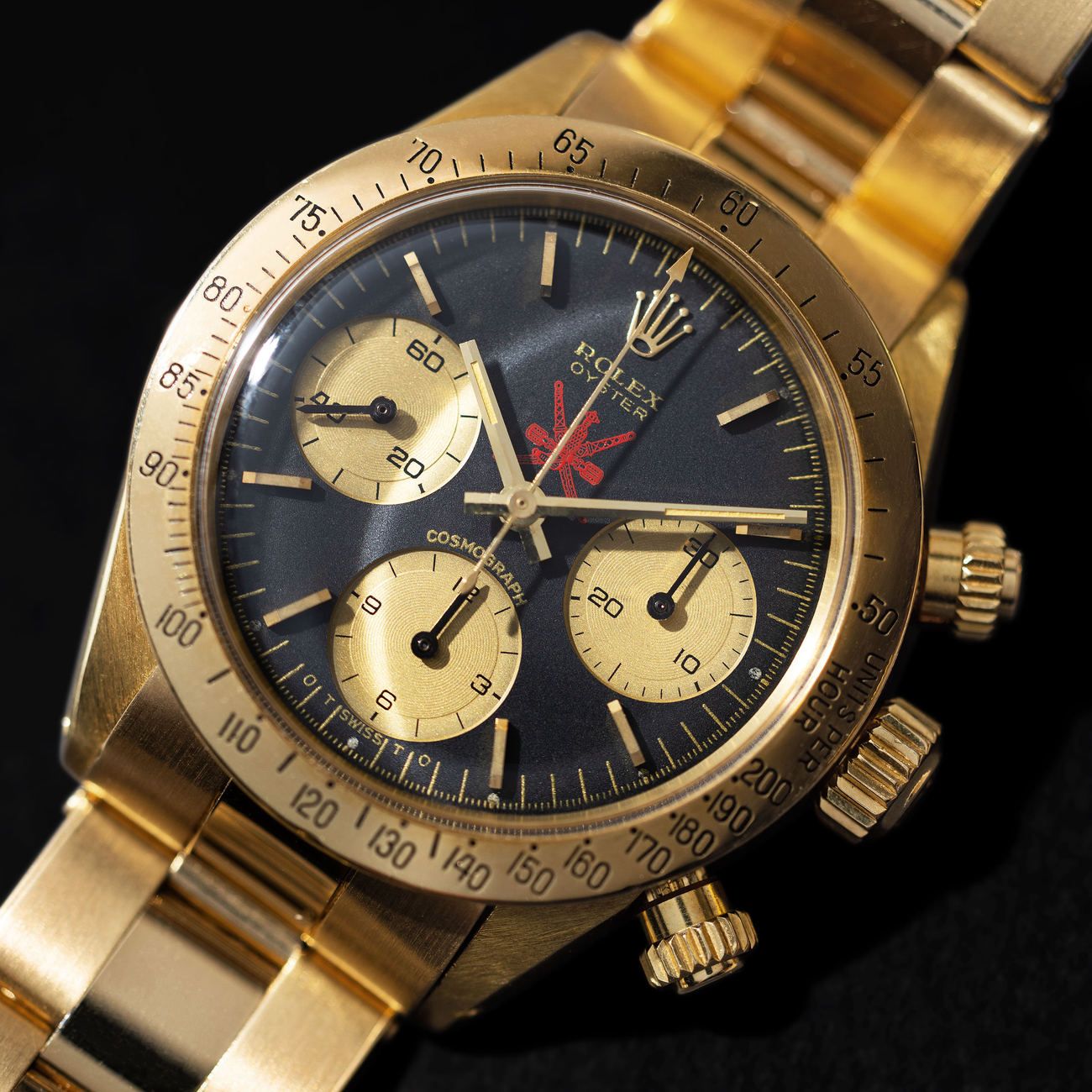 Lot 160 — ROLEX, Exceptional and Iconic, Daytona Cosmograph, Wristwatch in Yellow Gold, Black Dial, Red Khanjar Logo, Retailed by Asprey for the Sultanate of Oman, With Asprey Letter, Reference 6265 – Estimate: € 500,000 – 1,000,000 – VIEW LOT