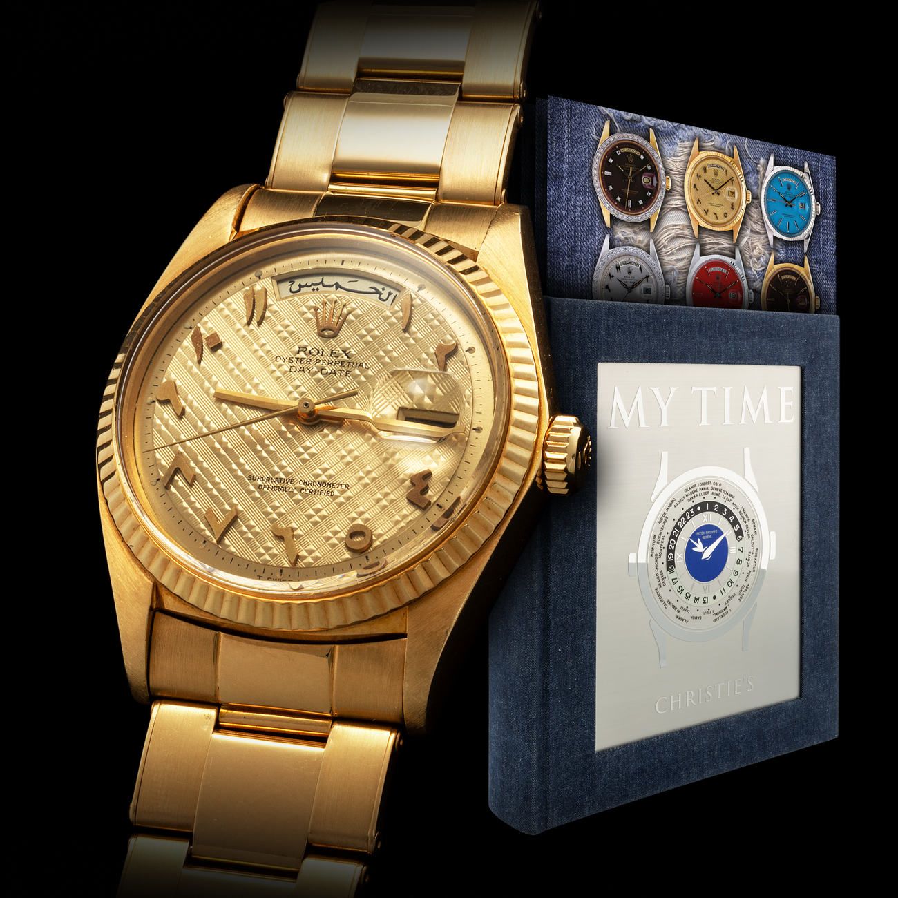 Lot 191 - Impressive, Exceptional and Absolutely Sought-After, Day-Date, Automatic Wristwatch in Yellow Gold, With Arabic Calendar, Applied Gold Arabic Numerals and Rare Tapisserie Dial, Reference 1803, Published in the Iconic Book “My Time” – Estimate: € 80,000 – 160,000 – View lot detail