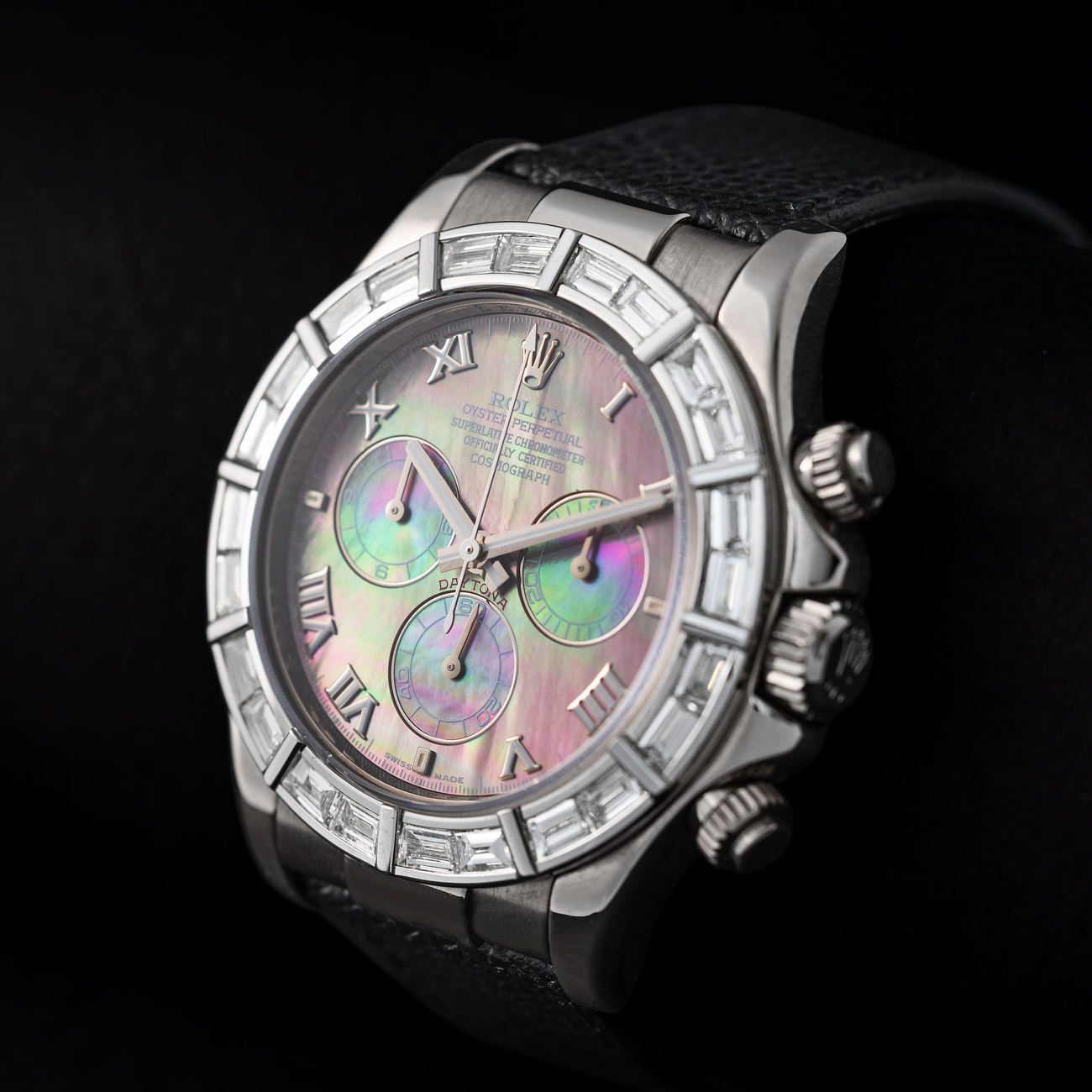 Lot 118 — ROLEX, Absolutely Magnificent and Precious, Daytona, Automatic Wristwatch in White Gold, Baguette Diamond-Set Bezel, Mother-of-Pearl Dial, Reference 116 589 – Estimate: € 80,000 – 160,000 – VIEW LOT