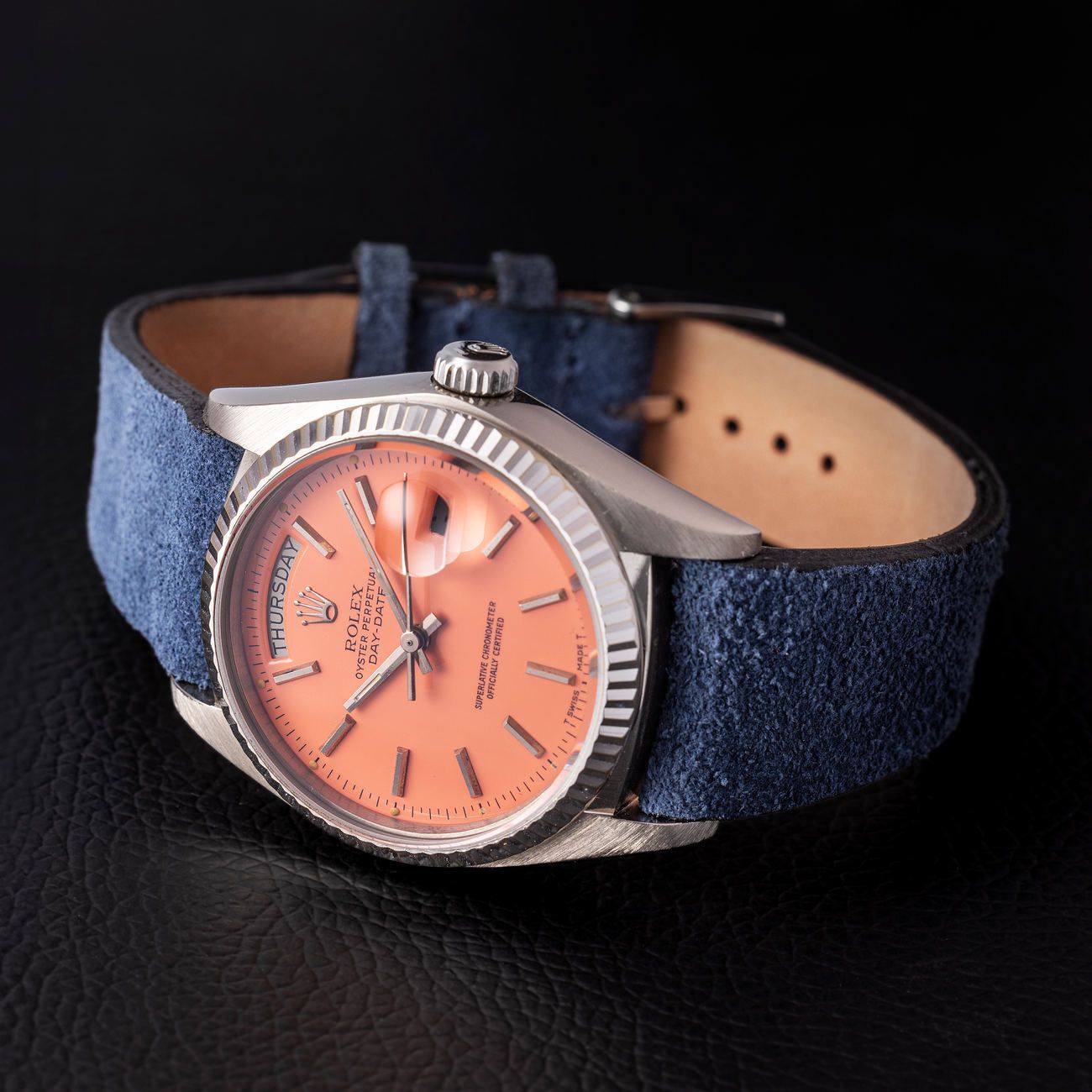Lot 178 – Astonishing Rolex Day-Date in white-gold reference 18 039, with pink lacquered “Stella” dial.