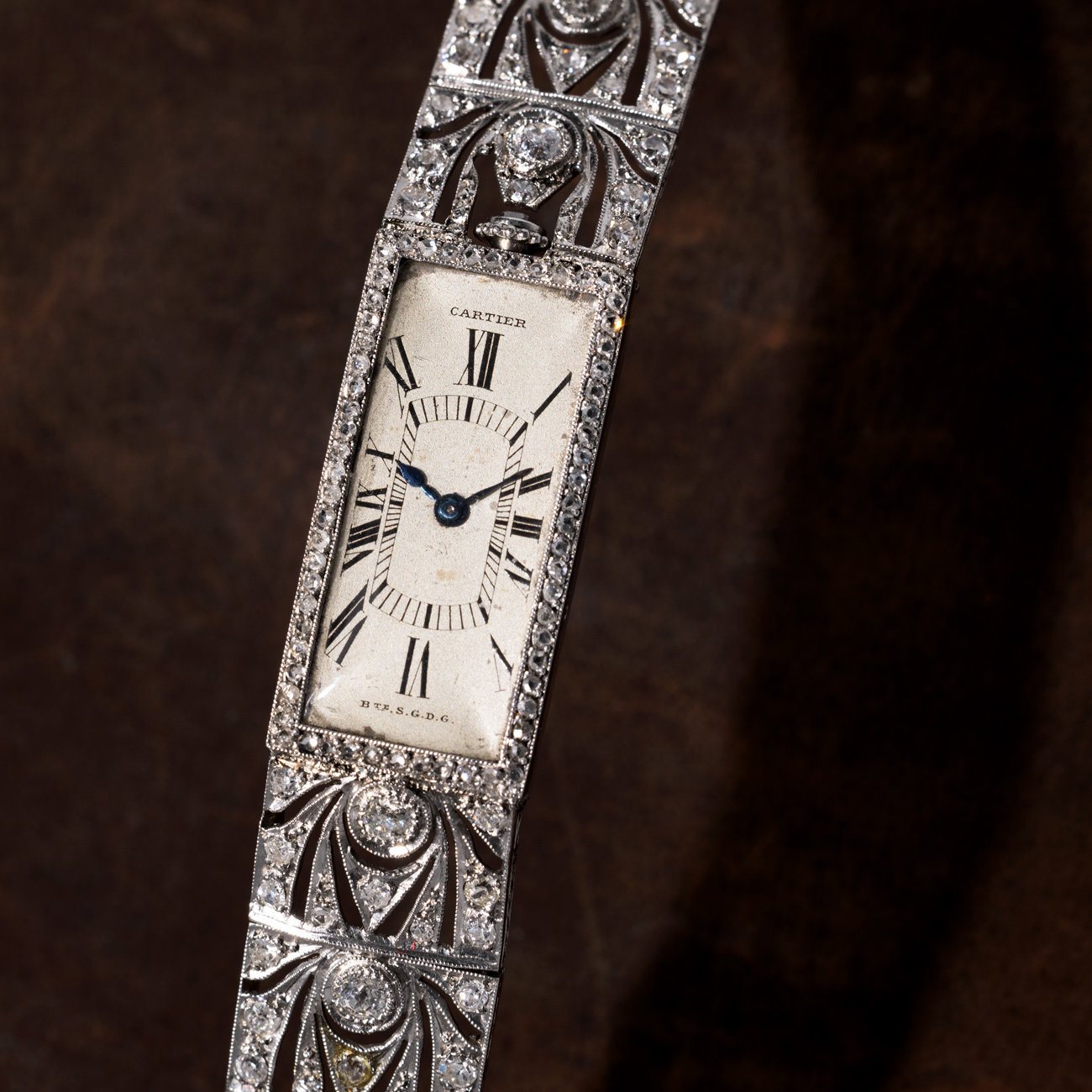 Lot 18 - Cartier Art Deco diamond wristwatch, white gold with integrated bracelet