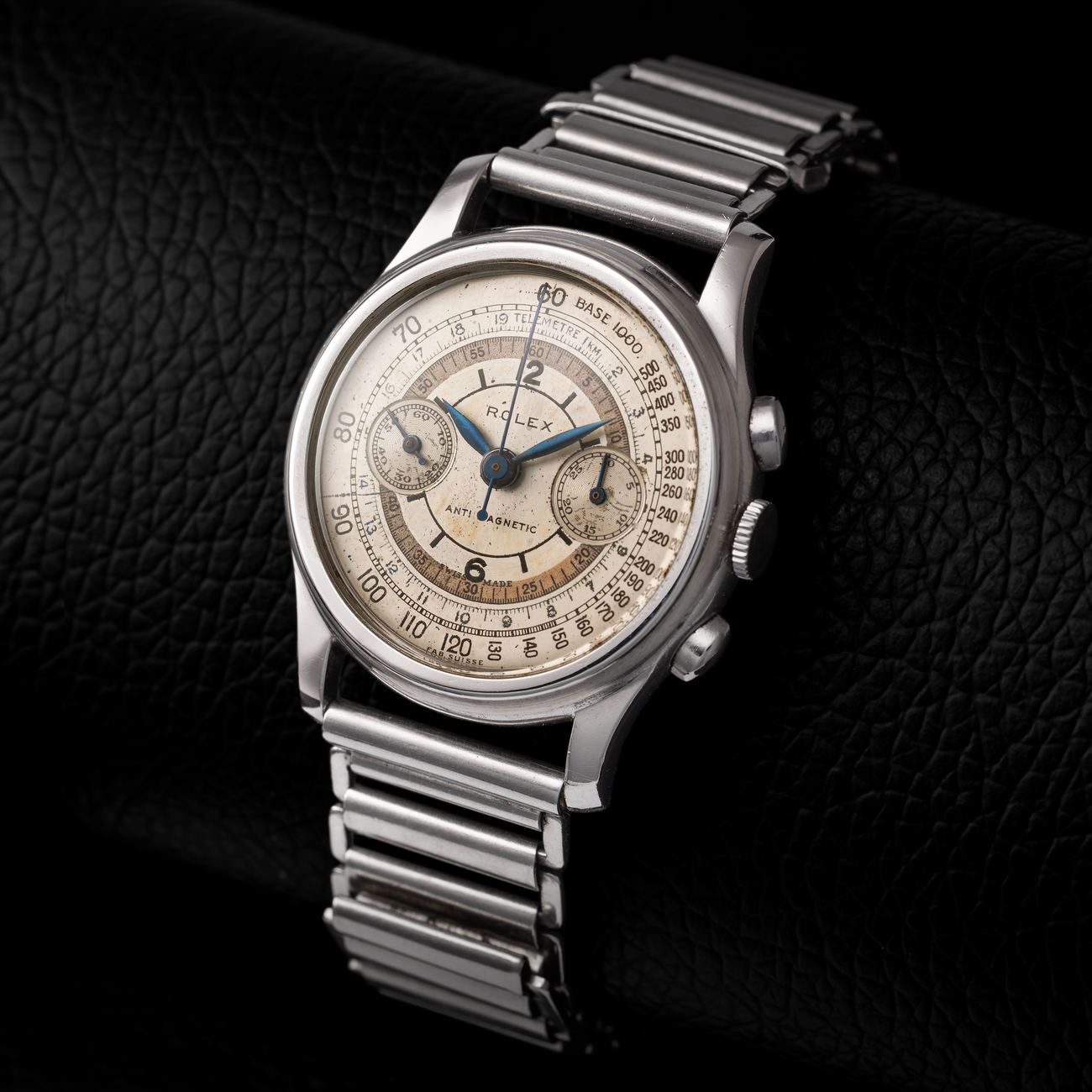 Lot 131 – Rolex Double Swiss “Piccolino”, antimagnetic chronograph wristwatch in steel, reference 3055, with tachymeter and telemeter scales and two-tone sector dial – View Lot