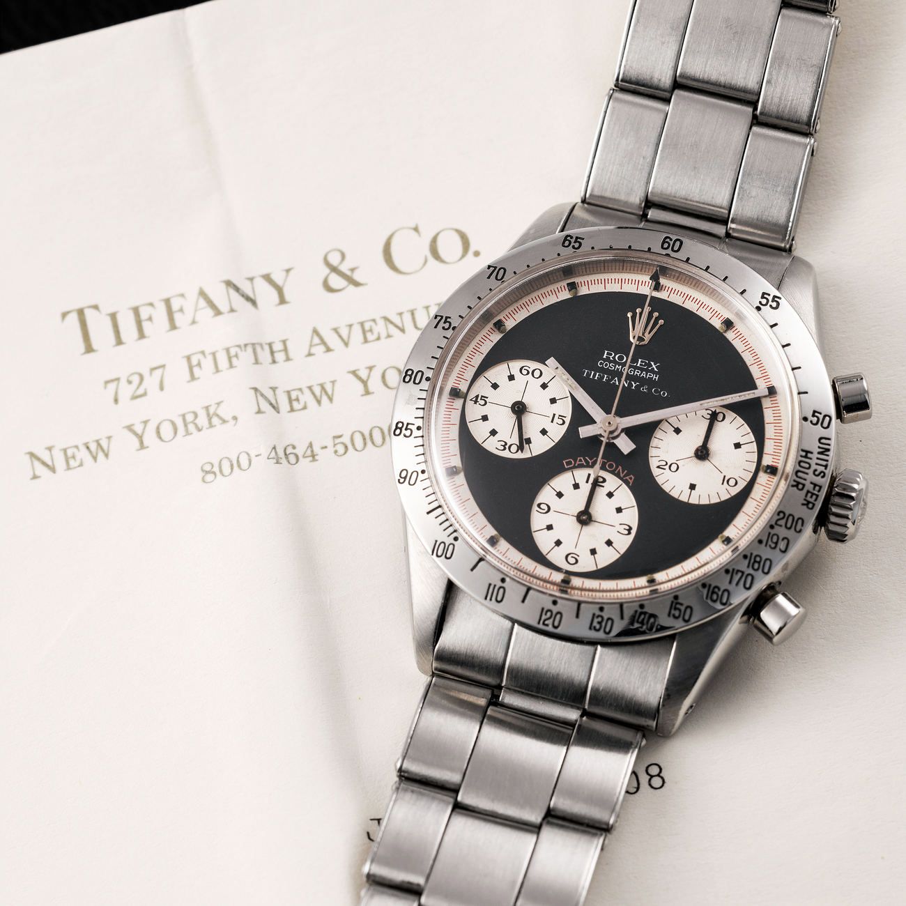 Lot 150 — Daytona Chronograph in Steel reference 6239. Black Paul Newman Dial retailed by Tiffany & Co with confirmation letter from Tiffany – View Lot