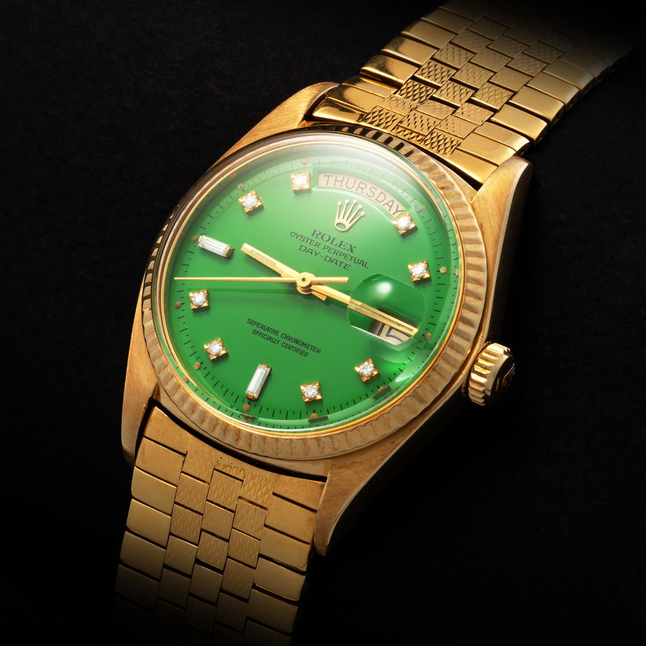 Lot 239 - Extremely Rare and Valuable, Day-Date, Automatic Wristwatch in Yellow Gold, With Green Lacquered “Stella” and Diamondset Dial, With Yellow Gold Flexible Bracelet, Reference 1803 – Estimate: € 40,000 – 80,000 – View lot detail