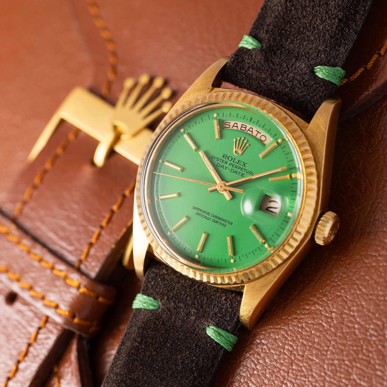Lot 141 – Rolex Day-Date in yellow-gold reference 1803, with green lacquered “Stella” dial and box.